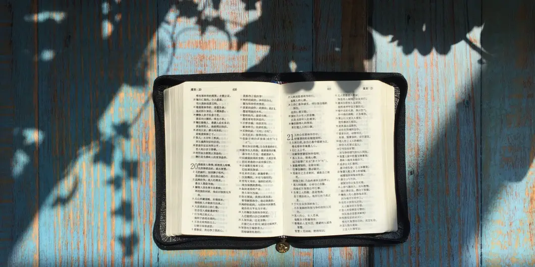 bible open on blue table